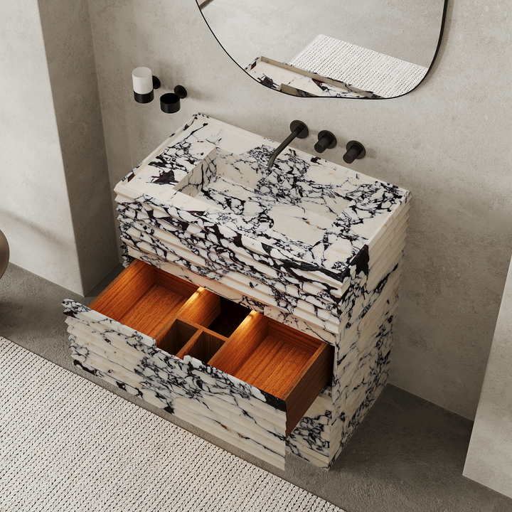 Njord single basin ribbed marble vanity medium in Calacatta Viola with open drawers