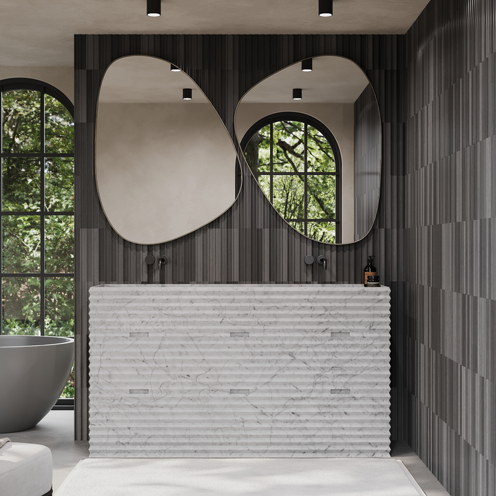 Njord ribbed marble vanity in luxury bathroom interior White Carrara