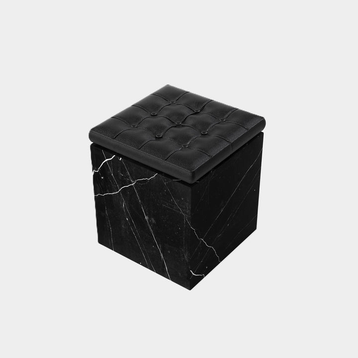 Halden tufted leather marble ottoman side view in Black Eagle