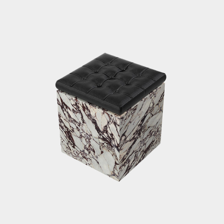 Halden tufted leather marble ottoman side view in Calacatta Viola