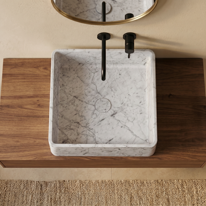 Maiken square basin in White Carrara marble top view showing polished interior bowl and subtle veining