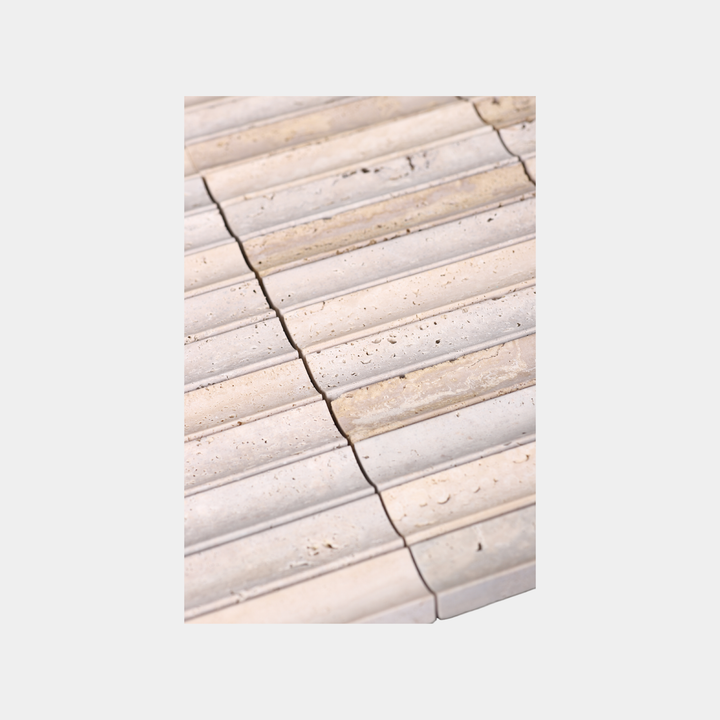 Close-up of inverted flute marble tile surface in Beige Travertine