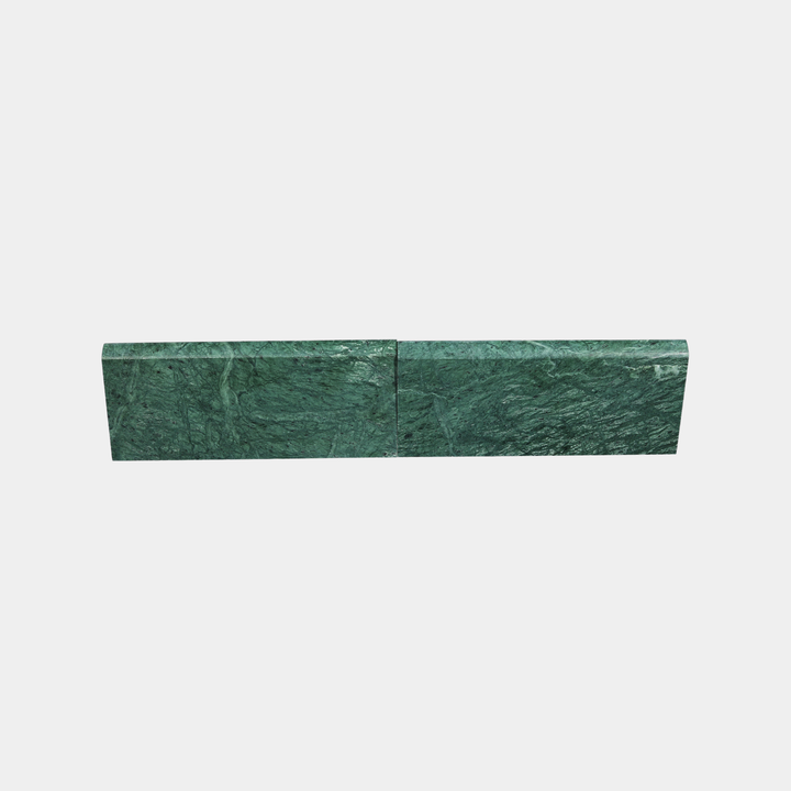 Close-up of Guatemala Verde marble surface on modern skirting board