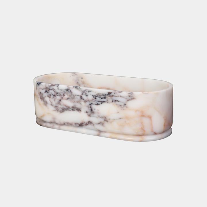 Leif oval bathtub side view in Calacatta Viola